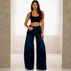 High-waisted dark wash barrel-leg jeans with black crop top, front view - Mis Divas Fashion
